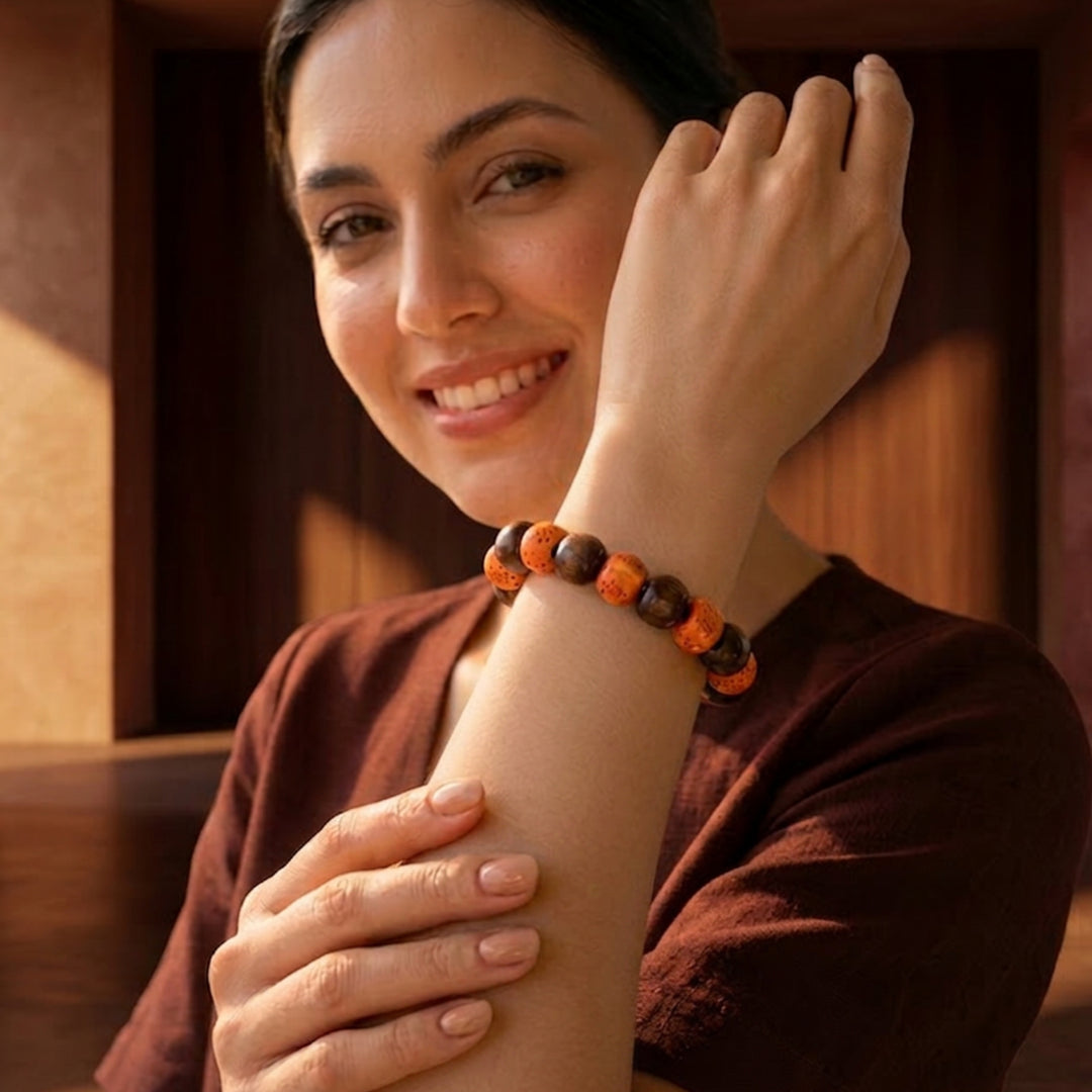 Ceramic and wood beaded bracelet worn on wrist for scale and styling