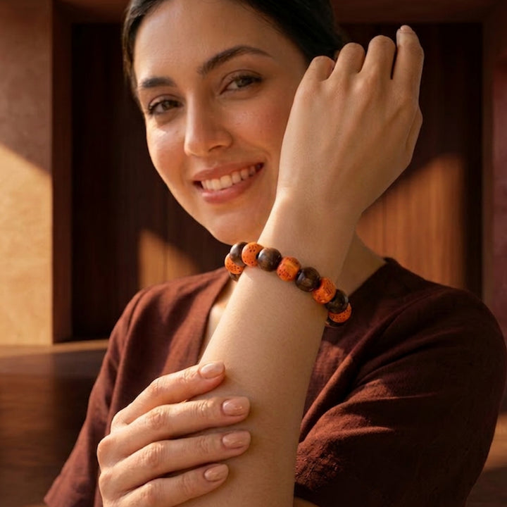 Ceramic and wood beaded bracelet worn on wrist for scale and styling