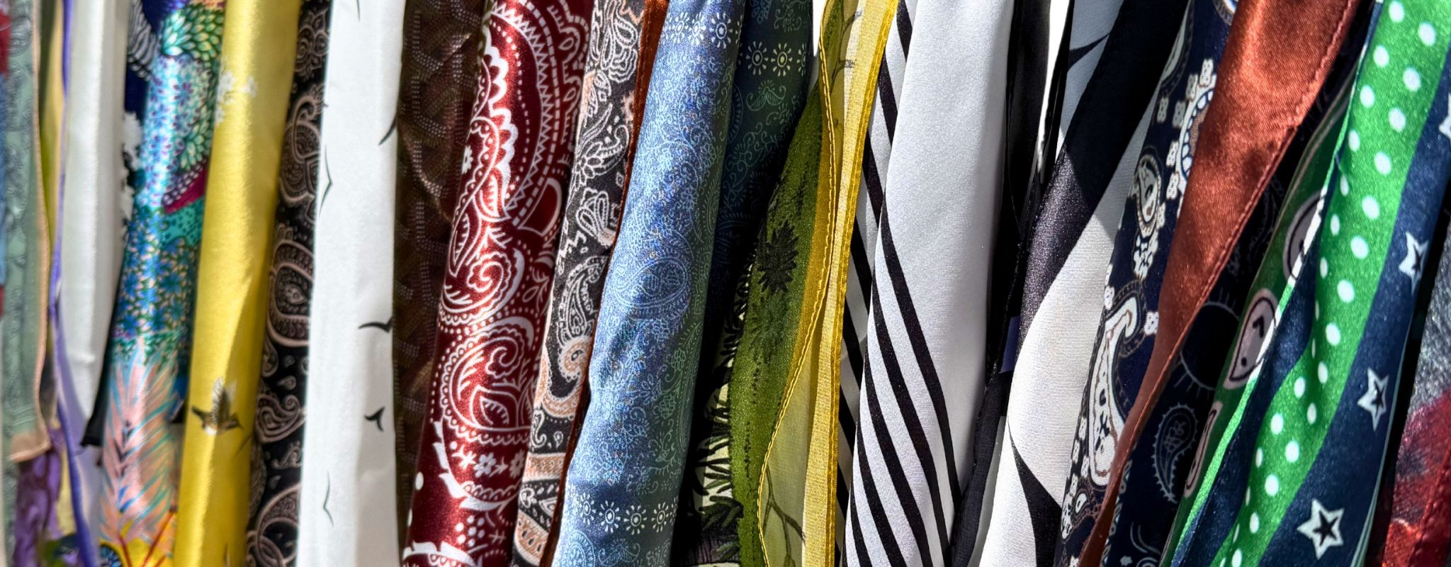 A luxury silk scarf collection in a great variety of colours and patterns.