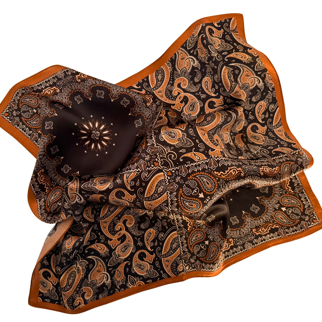 Black and copper silk scarf loosely spread to display the full design and copper border.
