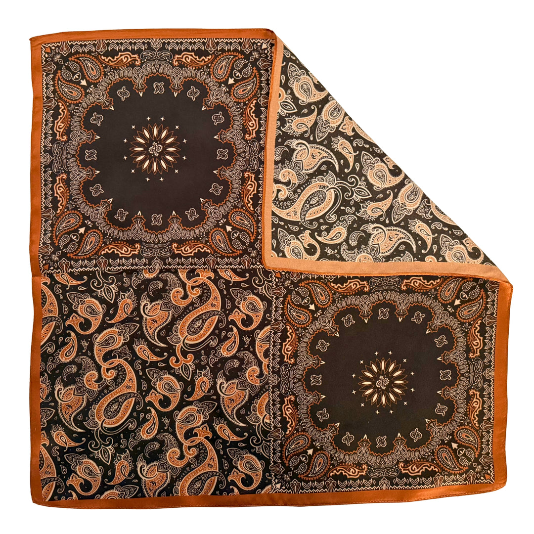 Black and copper silk scarf with folded corner showing reverse side and one-sided print.