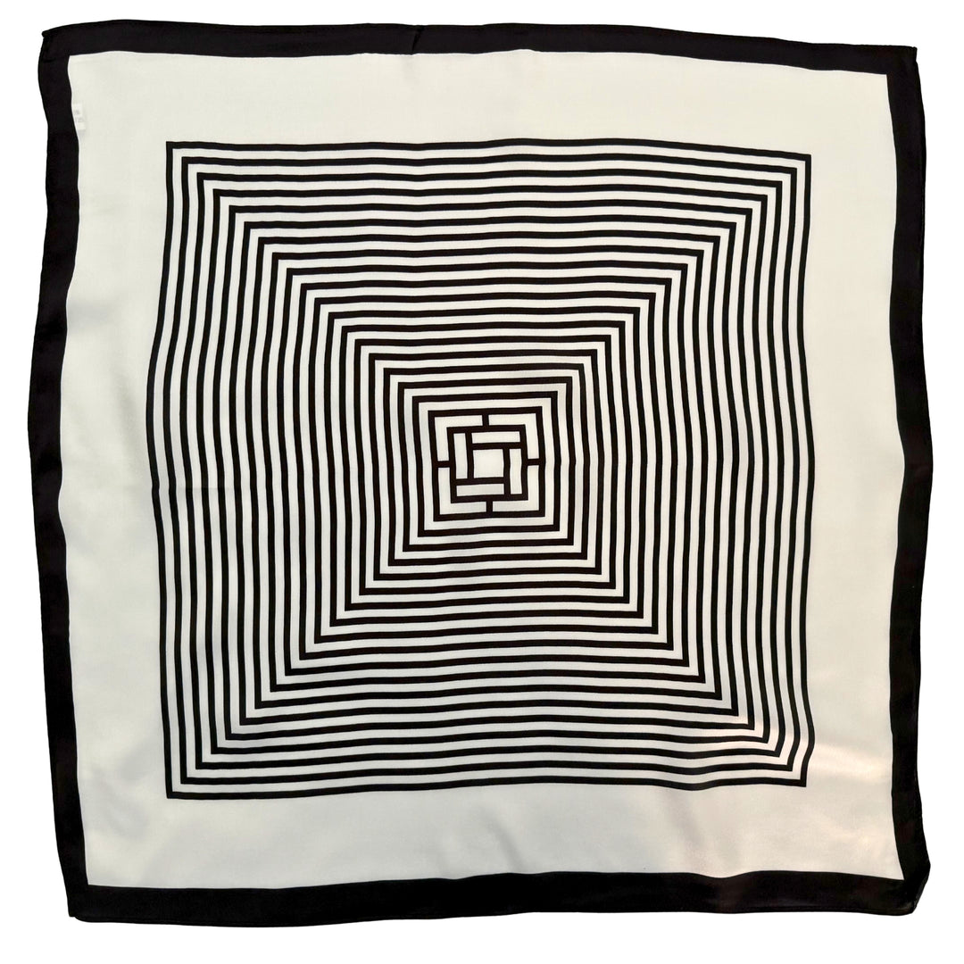 Full top view of a mulberry silk scarf featuring a black and ivory labyrinth geometric design with double border detailing.
