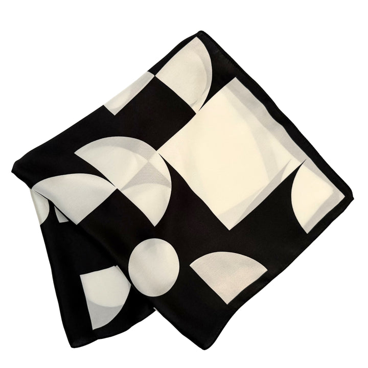 Silk scarf folded into a square layout showing different angles of the geometric pattern.