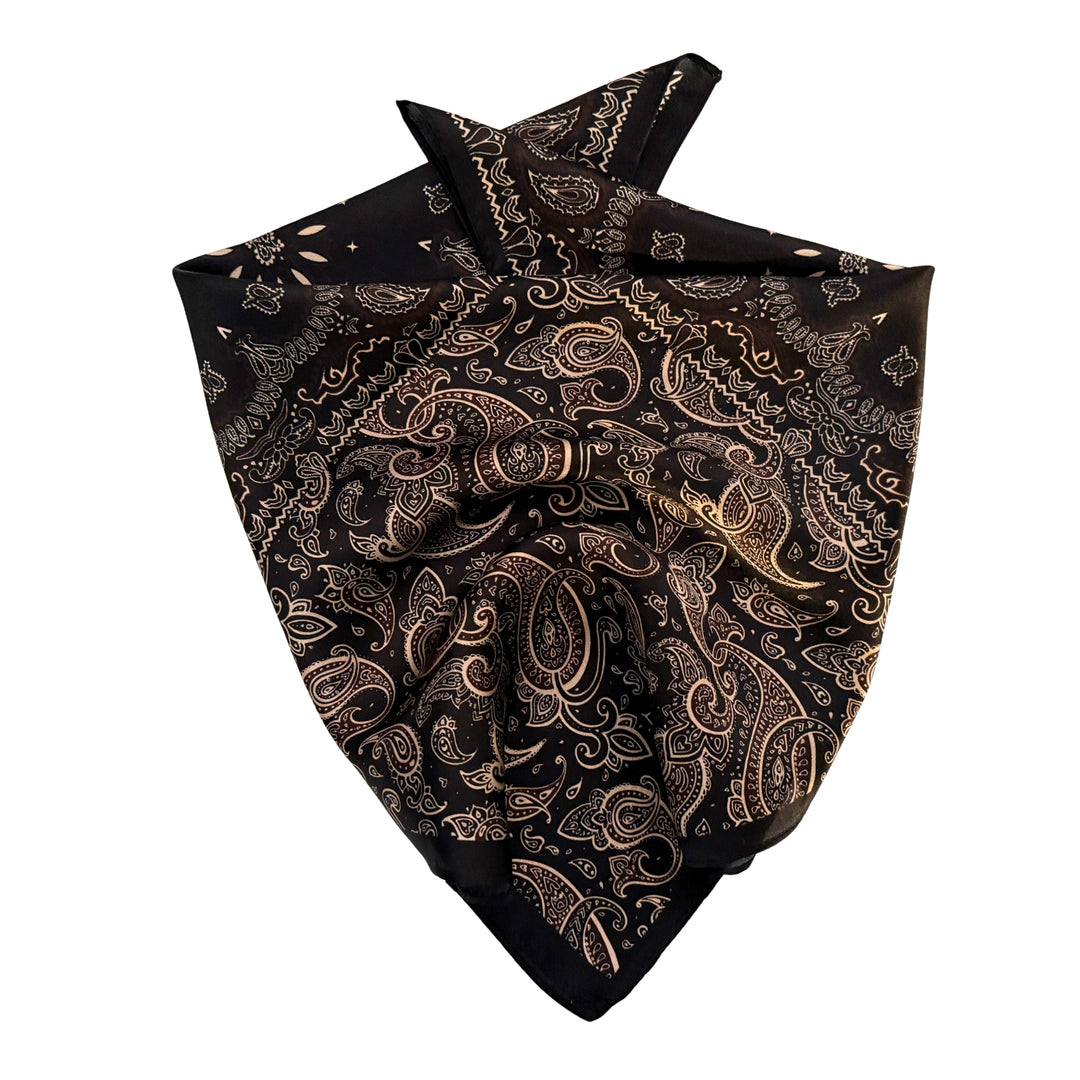 Floral paisley silk scarf neatly folded showing the detailed pattern and black border.