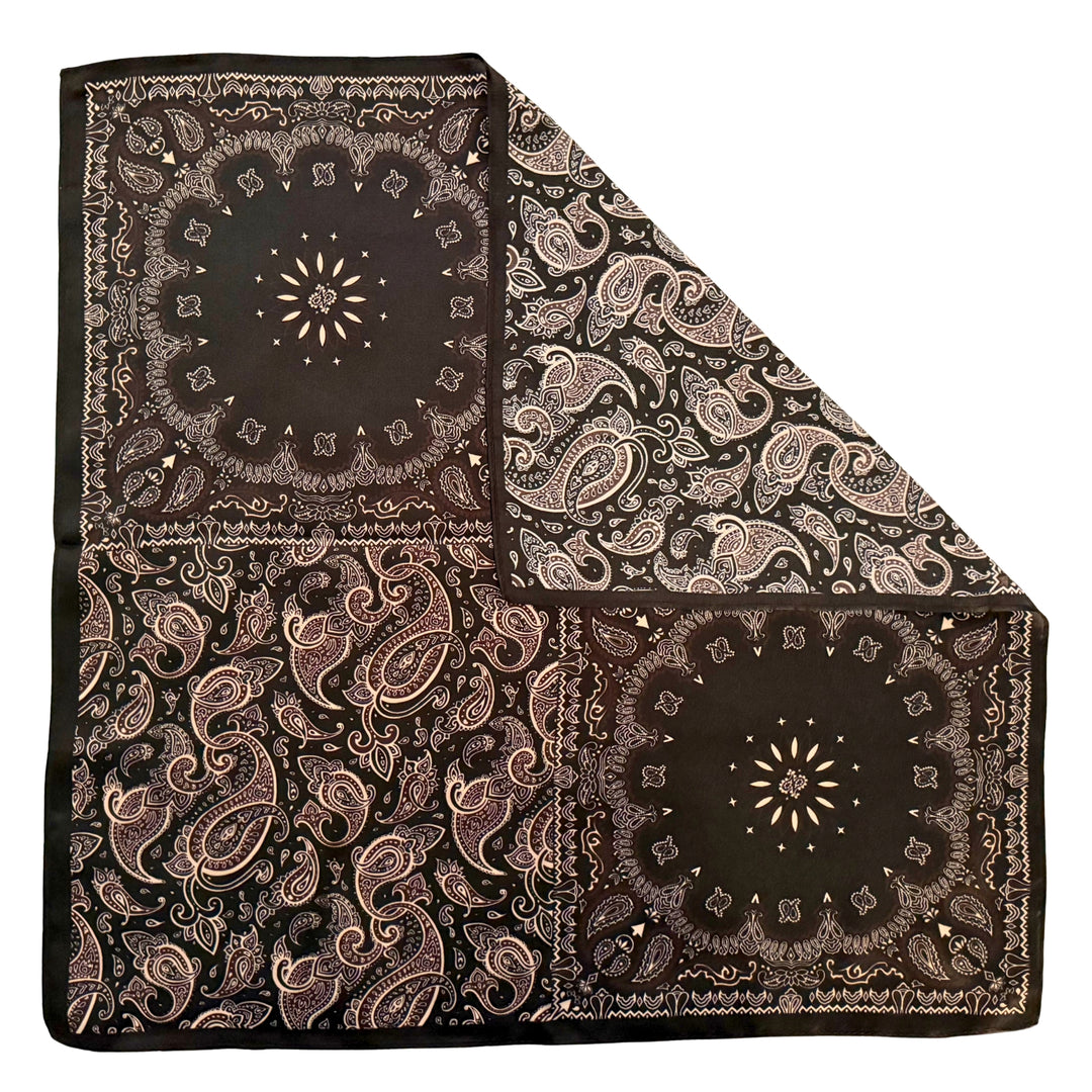 Floral paisley silk scarf with folded corner showing reverse side and one-sided print.