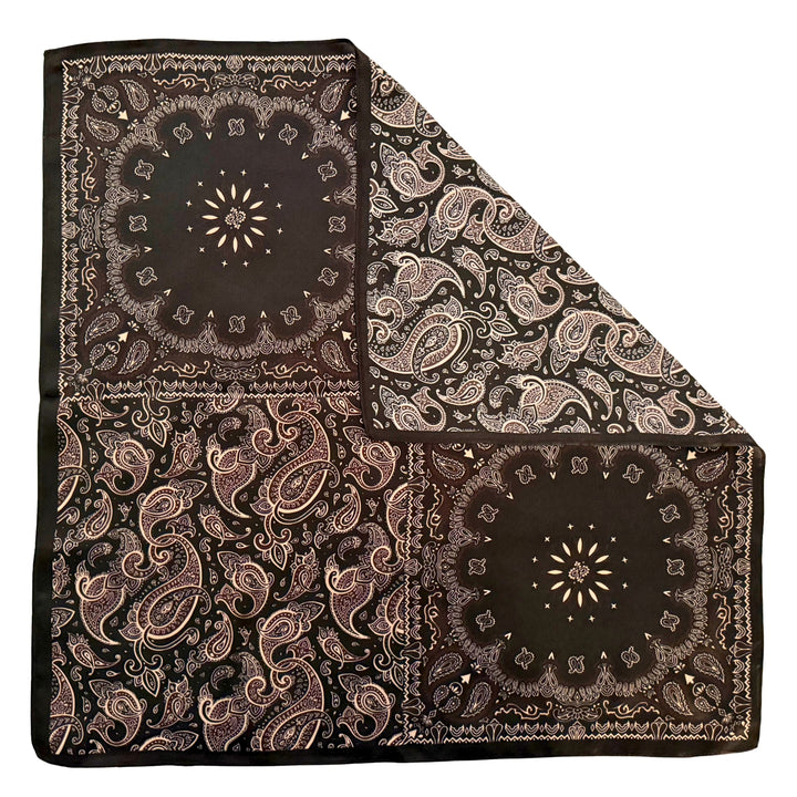 Floral paisley silk scarf with folded corner showing reverse side and one-sided print.