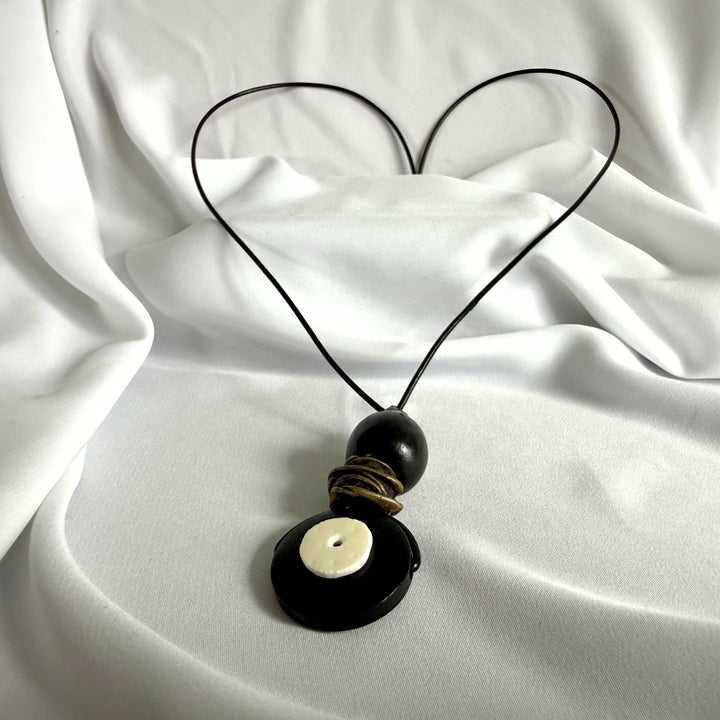 Black wooden pendant necklace with ostrich eggshell inlay – full view