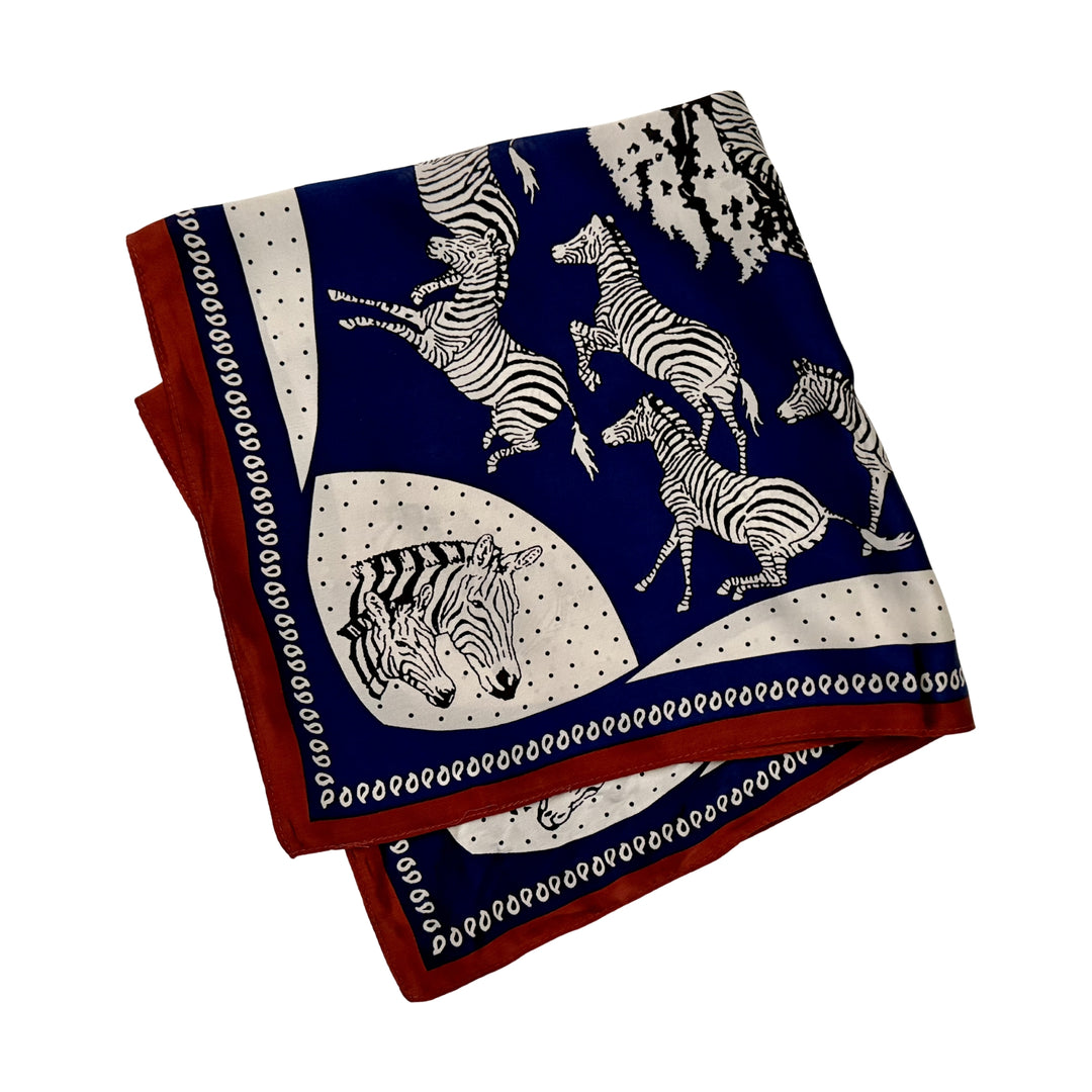 Blue and white zebra silk scarf folded into a square layout showing different angles of the pattern.