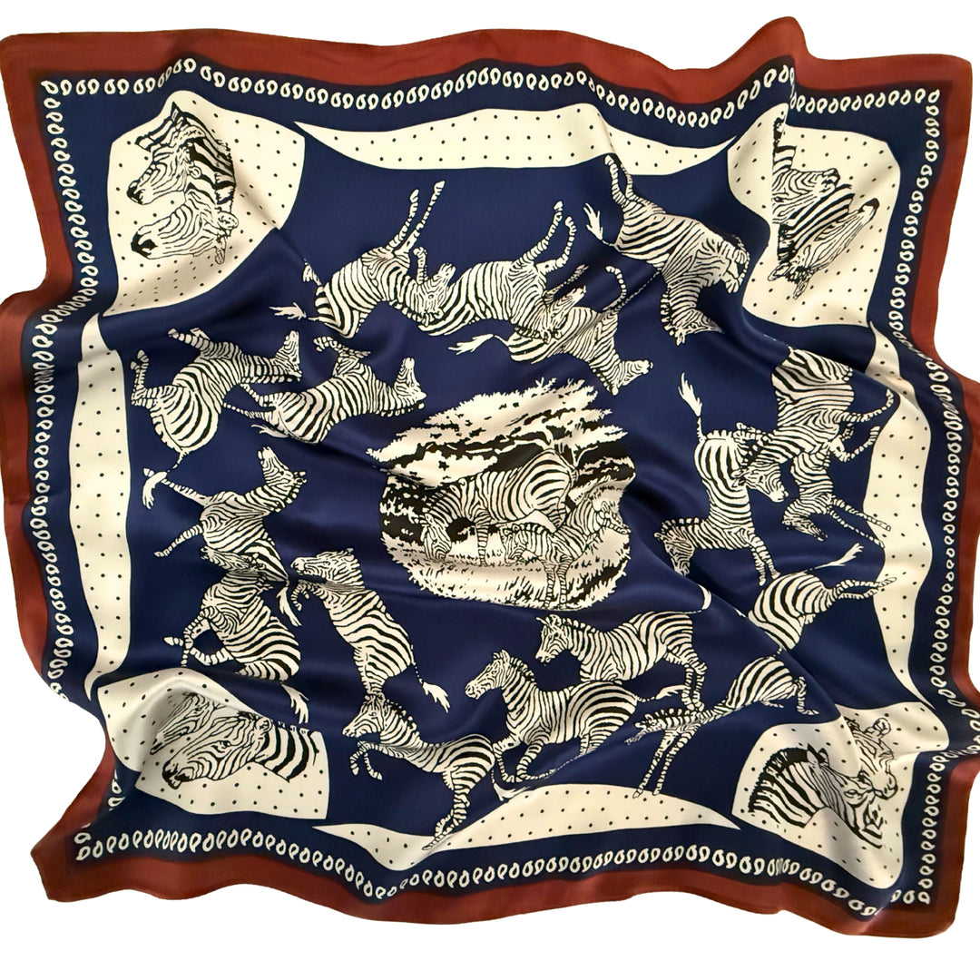 Blue and white zebra silk scarf softly laid out in a relaxed arrangement.