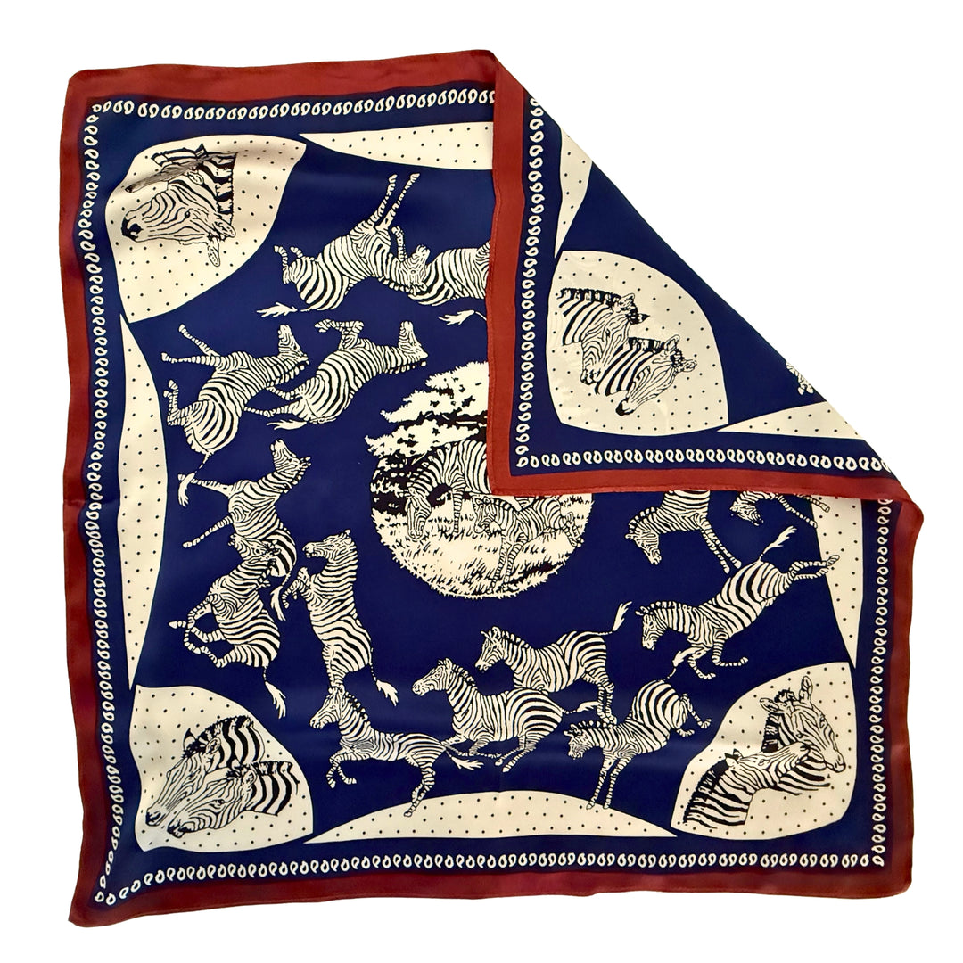 Blue and white zebra silk scarf with folded corner showing reverse side and one-sided print.
