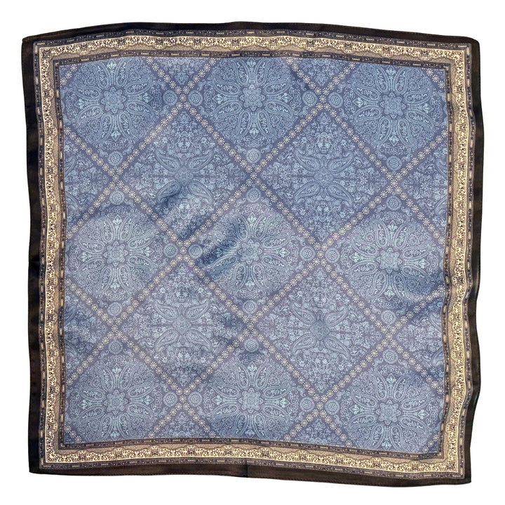 Blue silk scarf with white diamond pattern and black border shown in full top view.