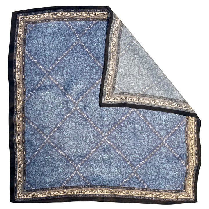 Blue diamond pattern silk scarf with folded corner showing reverse side and one-sided print.