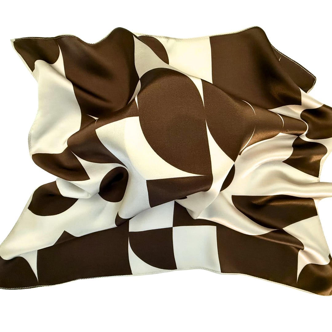 Brown geometric silk scarf loosely spread to display the overall design.