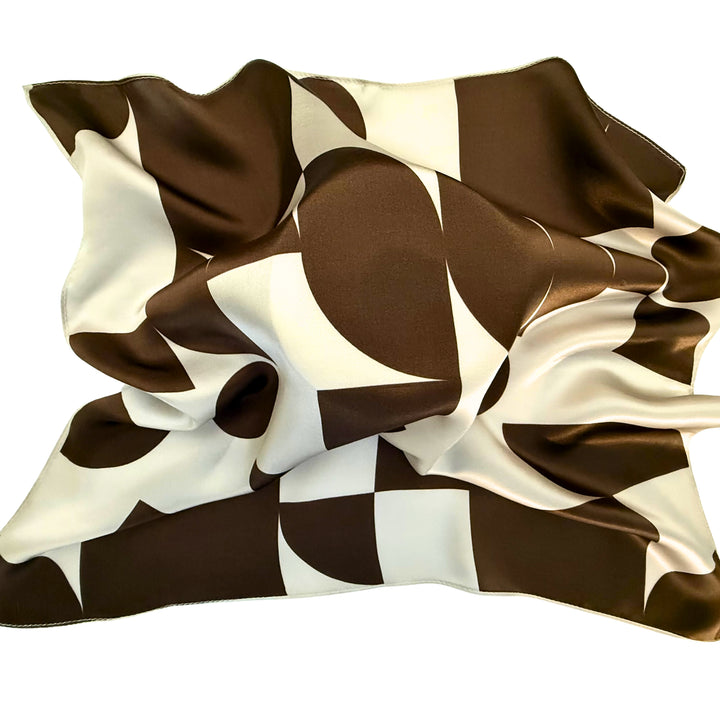 Brown geometric silk scarf loosely spread to display the overall design.