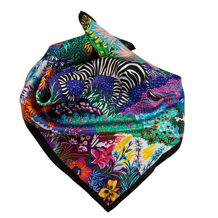 Colourful zebra silk scarf neatly folded showing the vibrant design.