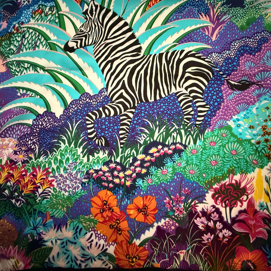 Close-up of colourful zebra and nature-inspired print on silk fabric.