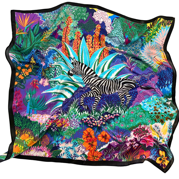 Colourful zebra silk scarf softly laid out in a relaxed arrangement.
