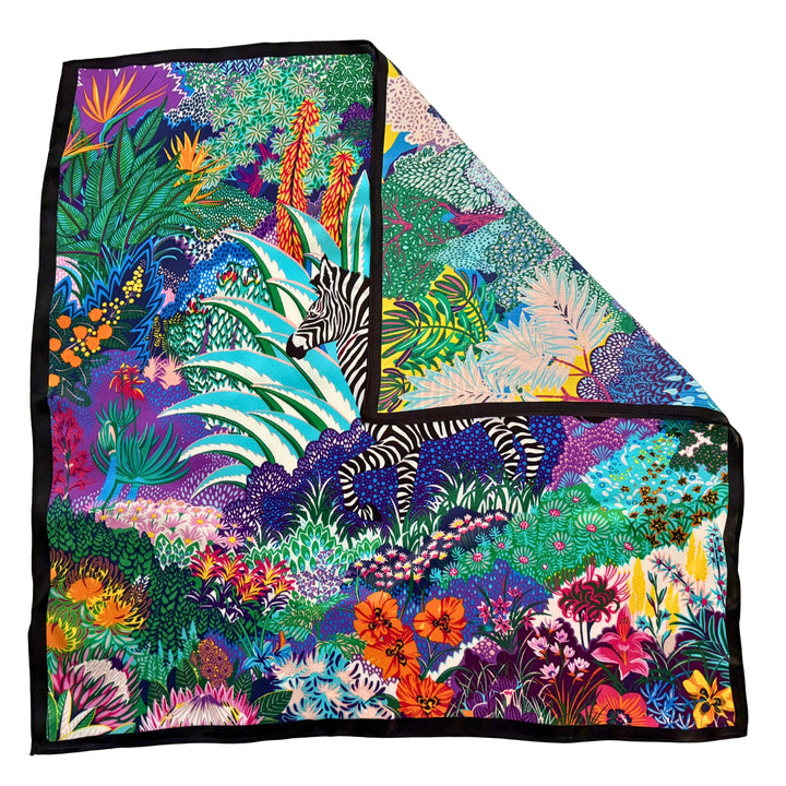 Colourful zebra silk scarf with folded corner showing the reverse side and one-sided print.