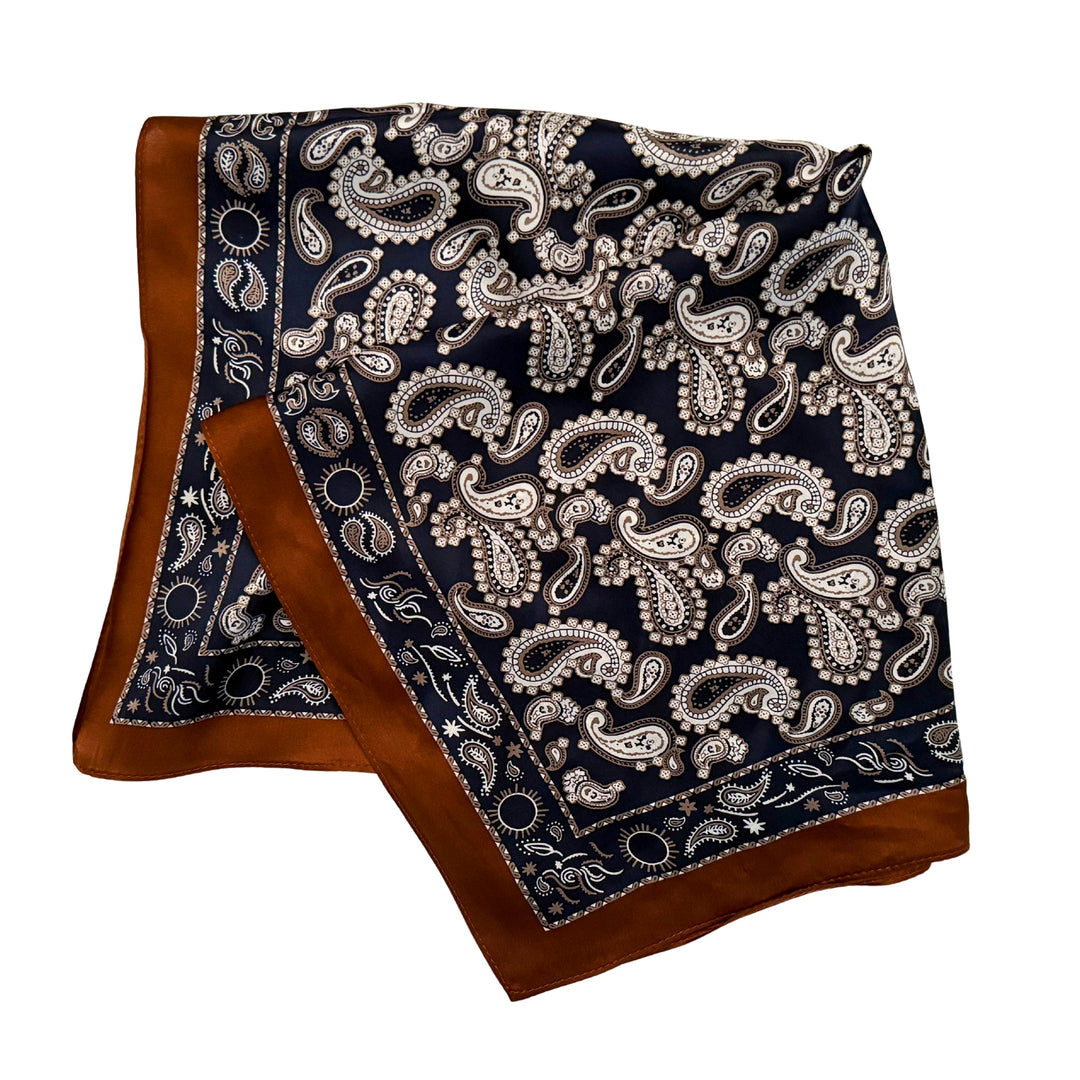 Dark blue paisley silk scarf folded into a square layout showing different angles of the pattern.