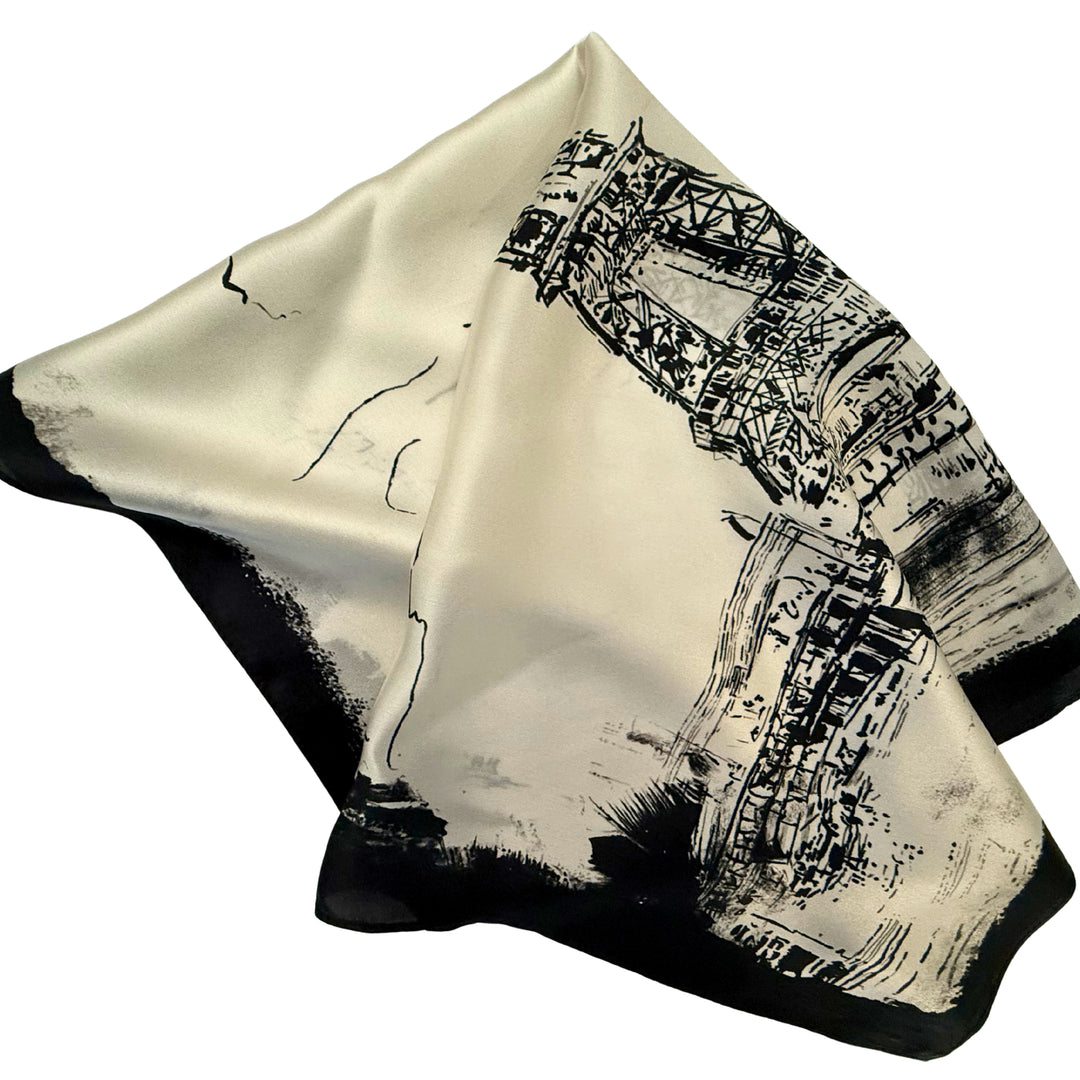 Eiffel Tower silk scarf folded into a square layout showing different angles of the design.