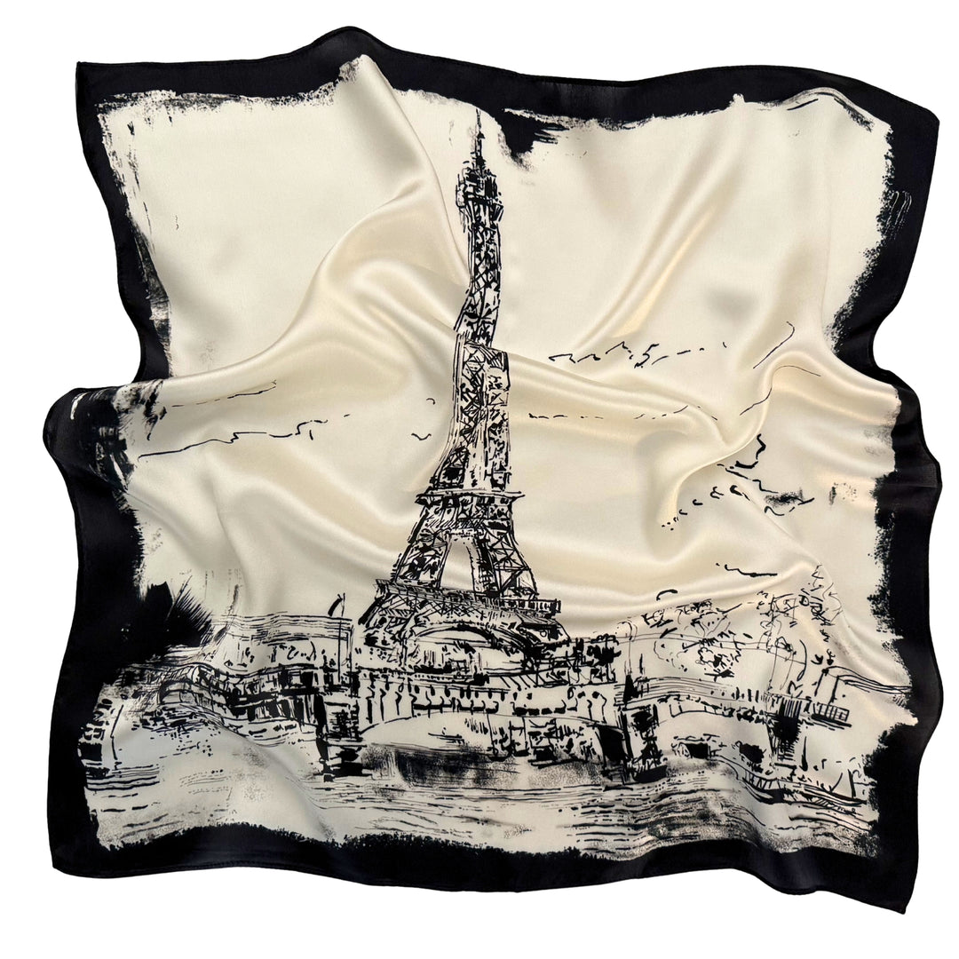 Eiffel Tower silk scarf softly laid out in a relaxed arrangement.