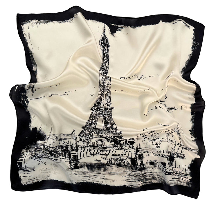 Eiffel Tower silk scarf softly laid out in a relaxed arrangement.