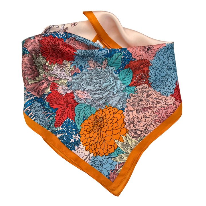 Floral horse silk scarf neatly folded showing the colourful horse design.