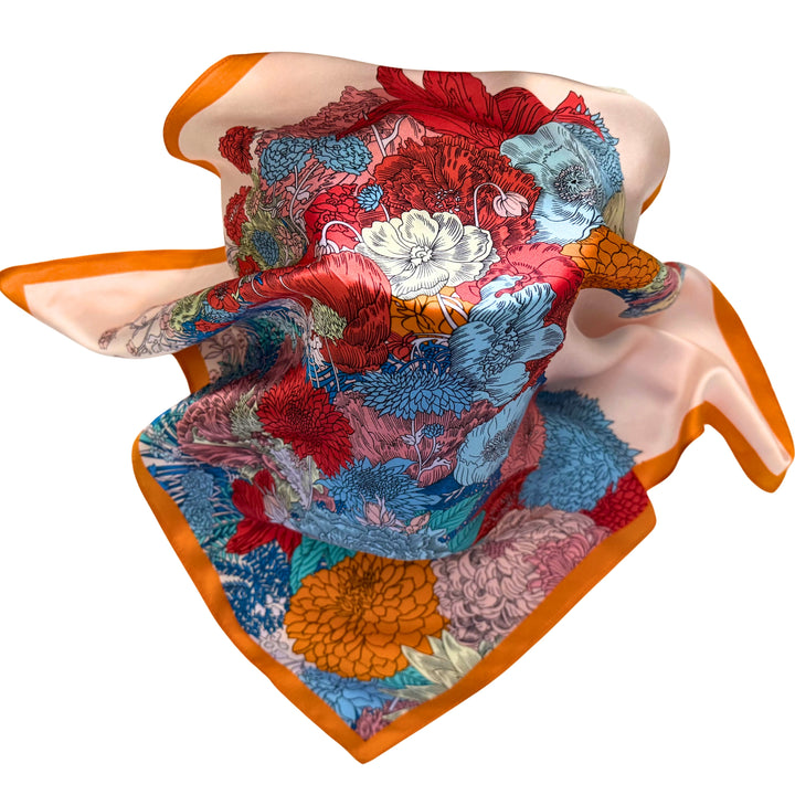 Floral horse silk scarf loosely spread to display the full design and orange border.