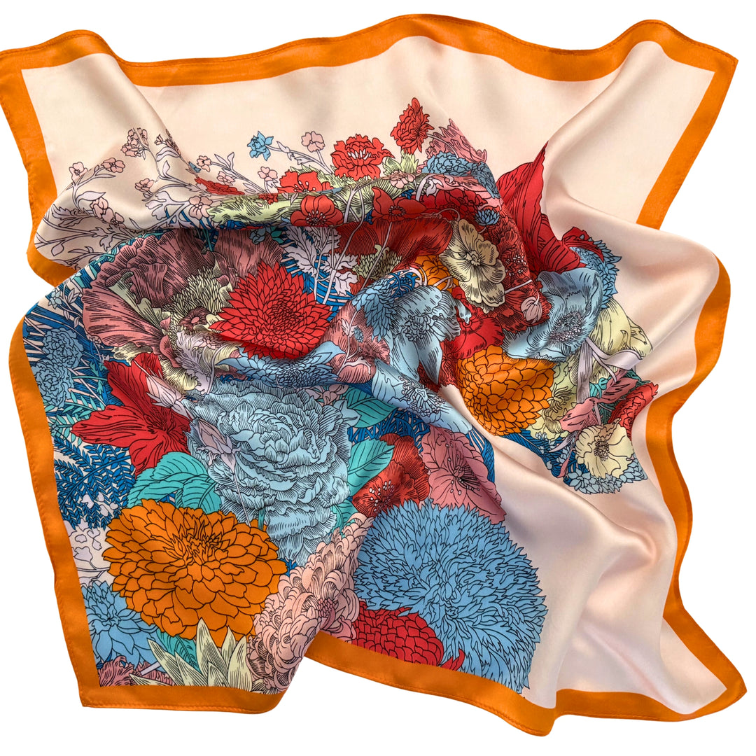 Floral horse silk scarf softly laid out in a relaxed arrangement.