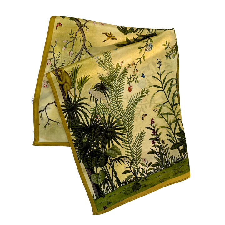 Green botanical silk scarf folded into a square layout showing different areas of the print.
