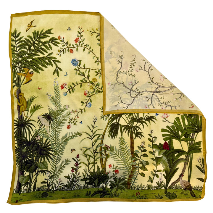 Green botanical silk scarf with folded corner showing the reverse side and one-sided print.