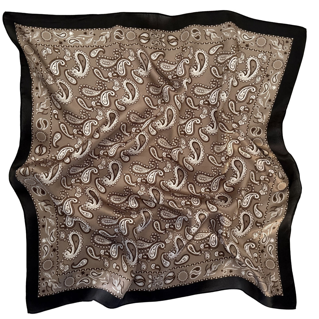 Grey beige paisley silk scarf arranged in a relaxed flat lay.