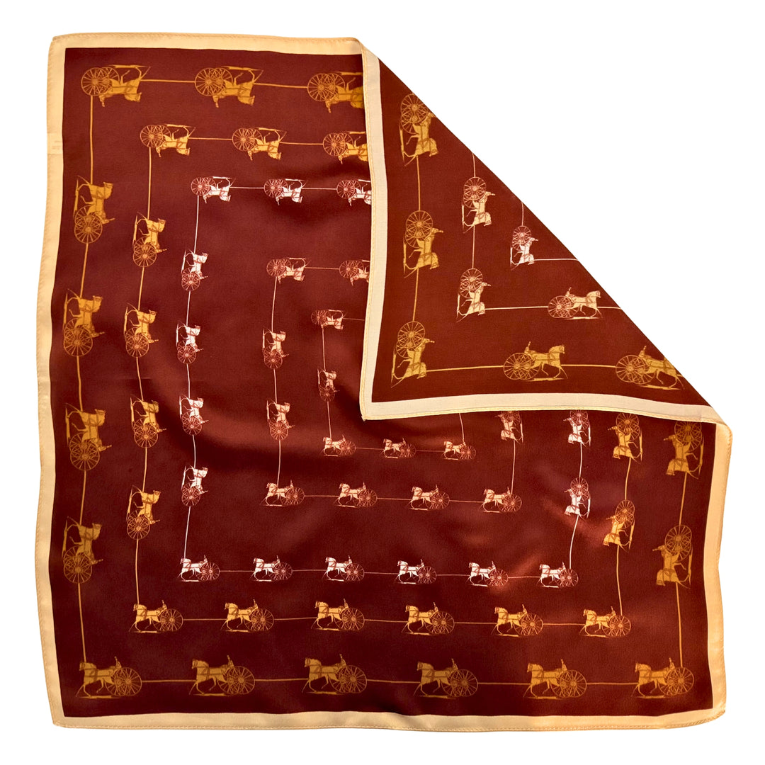 Horse and carriage silk scarf with folded corner showing reverse side and one-sided print.
