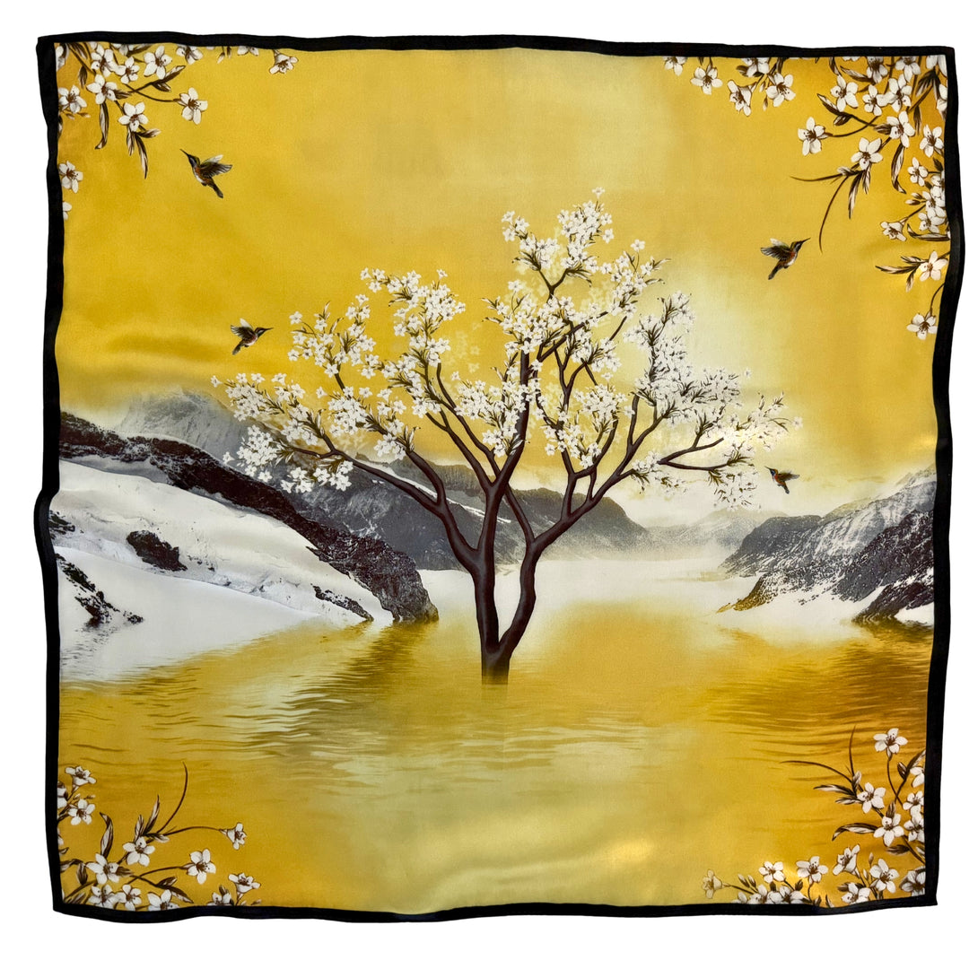 Full top view of a mulberry silk scarf featuring a yellow, brown, grey, and white landscape print with a black border.