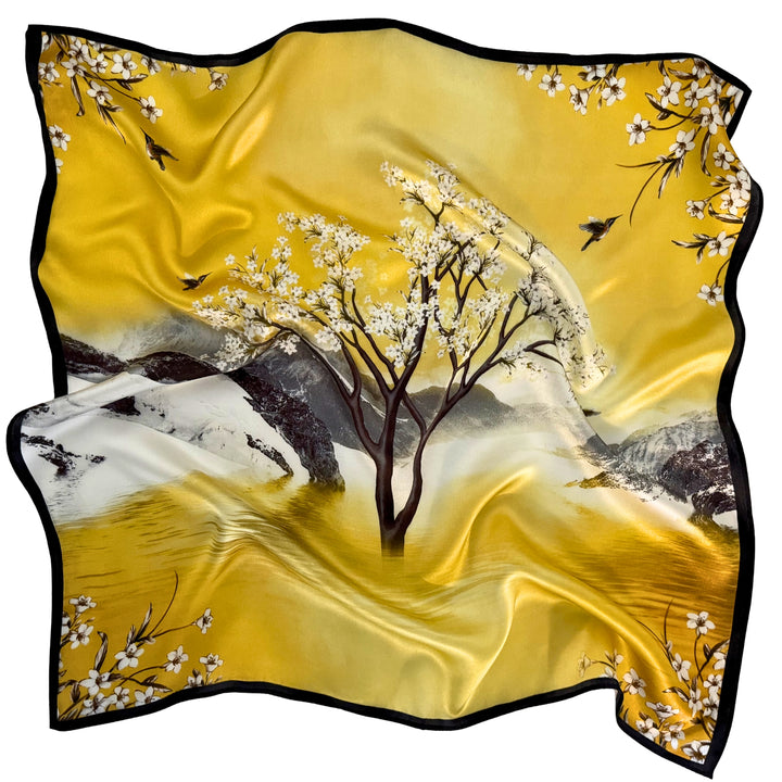 Mulberry silk scarf laid in a relaxed arrangement showing the full scenic landscape design and black border.