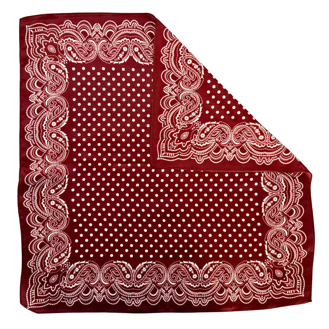 Maroon paisley silk scarf with folded corner showing reverse side and one-sided print.