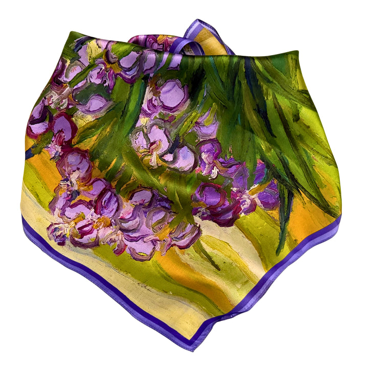 Purple floral silk scarf neatly folded to highlight the floral design.