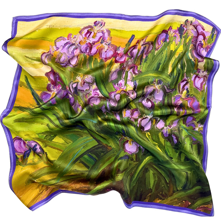 Purple floral silk scarf softly laid out in a relaxed arrangement.
