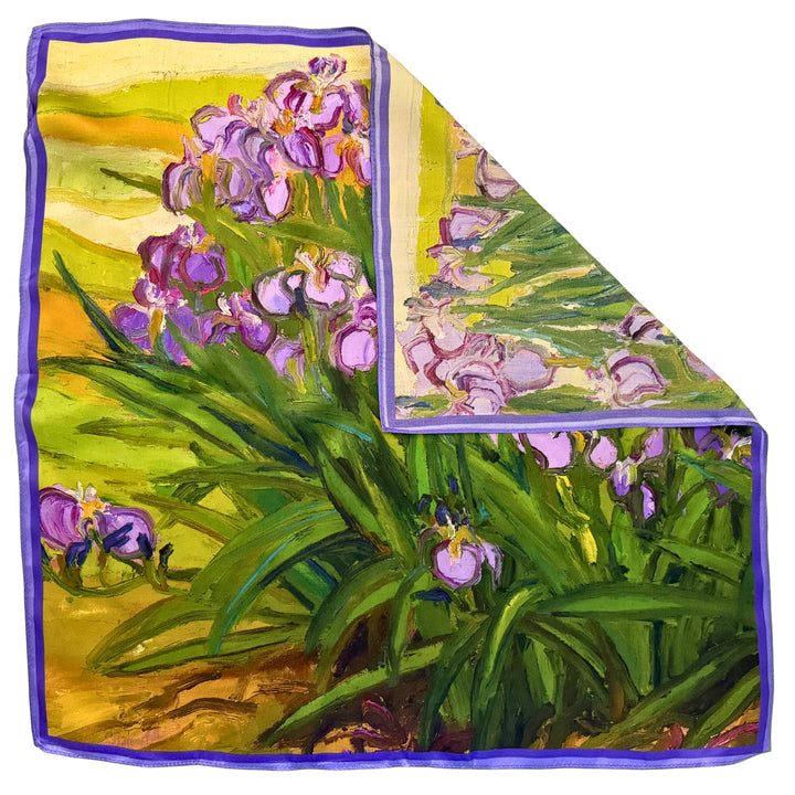 Purple floral silk scarf with folded corner showing the reverse side and one-sided print.