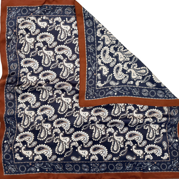 Paisley silk scarf with folded corner showing the reverse side and one-sided print.
